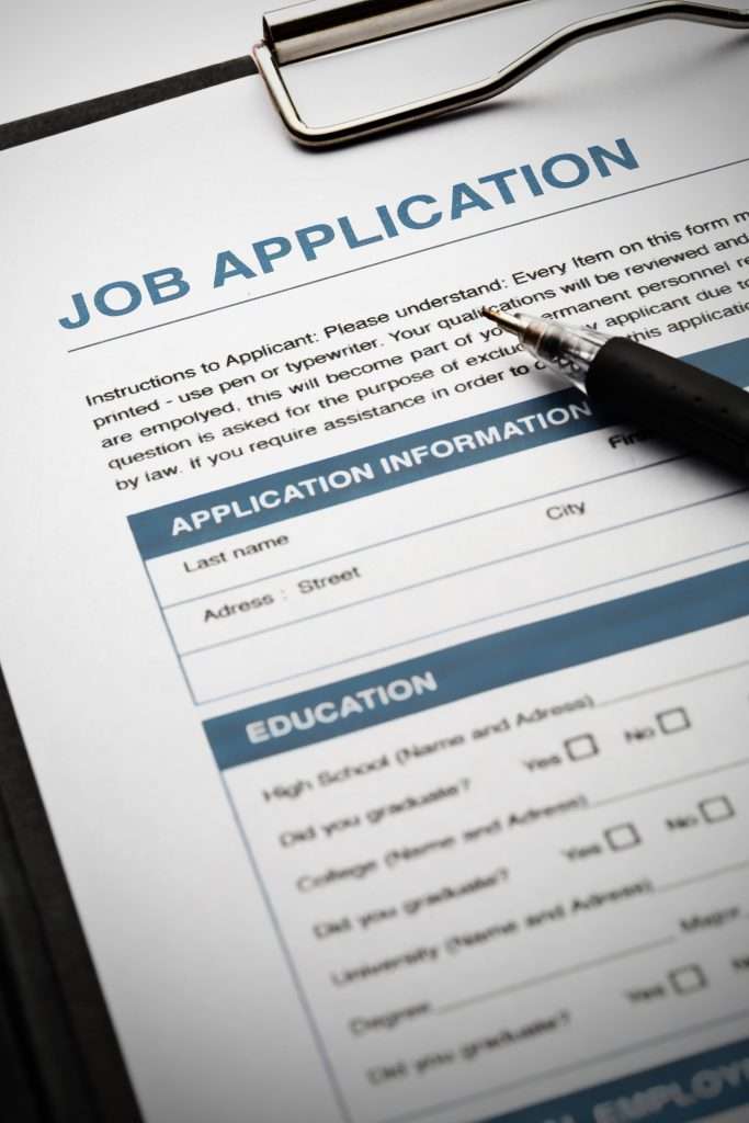 Job application on clipboard